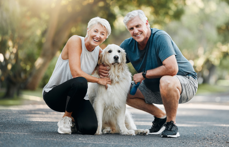 living_happy_with_hearing_loss_senior_couple_with_dog