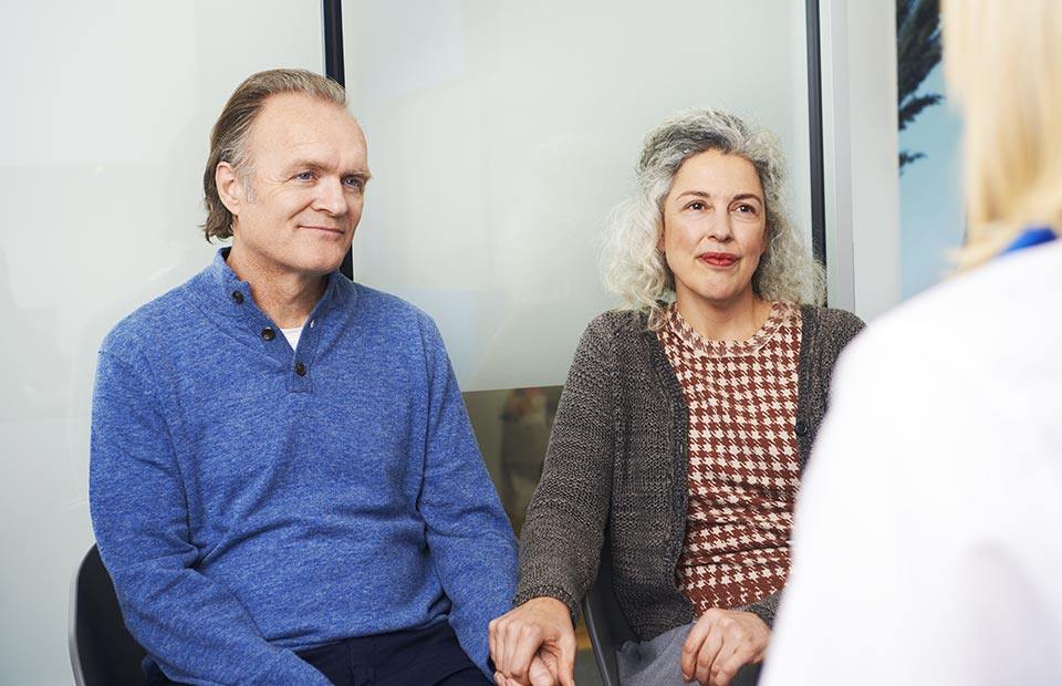 image shows couple at a hearing test