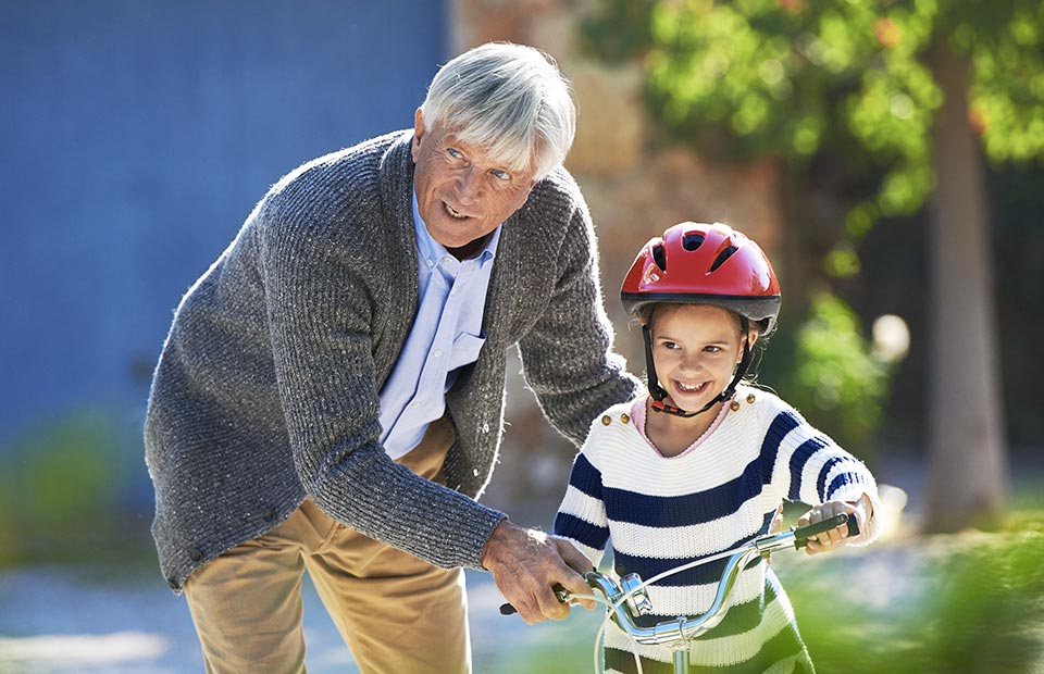 image shows grandfather and grandson happy