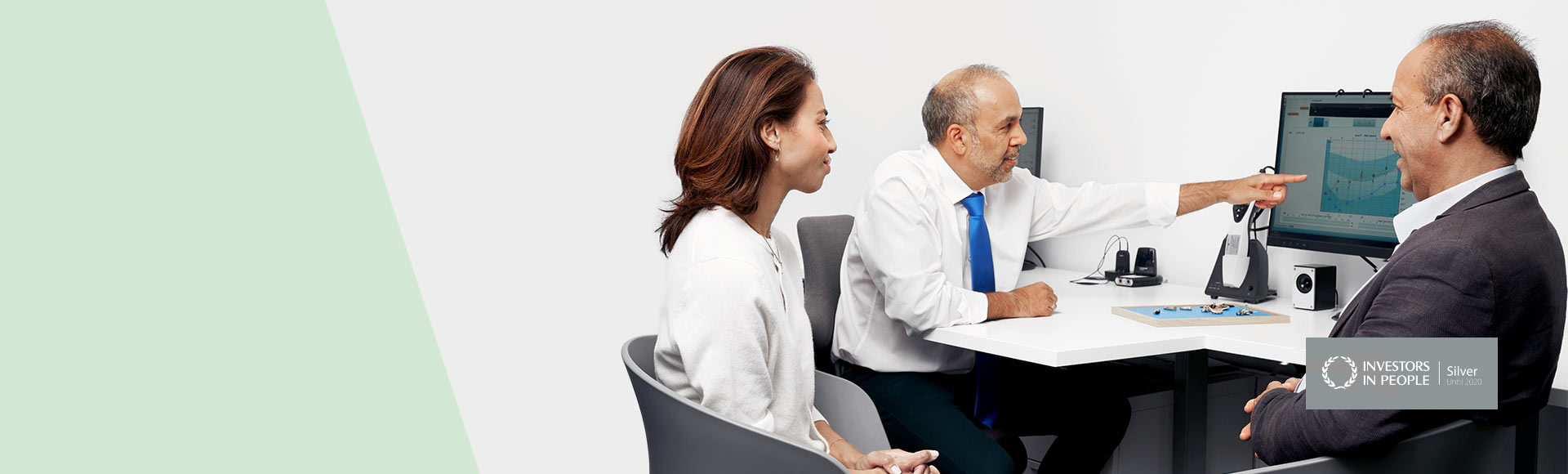 image shows two people and audiologist