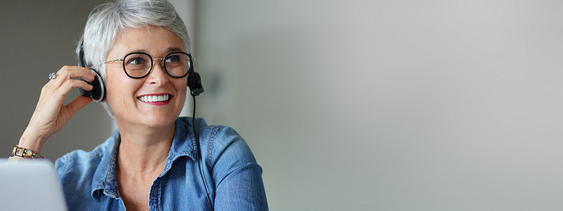 Smiling woman having hearing test