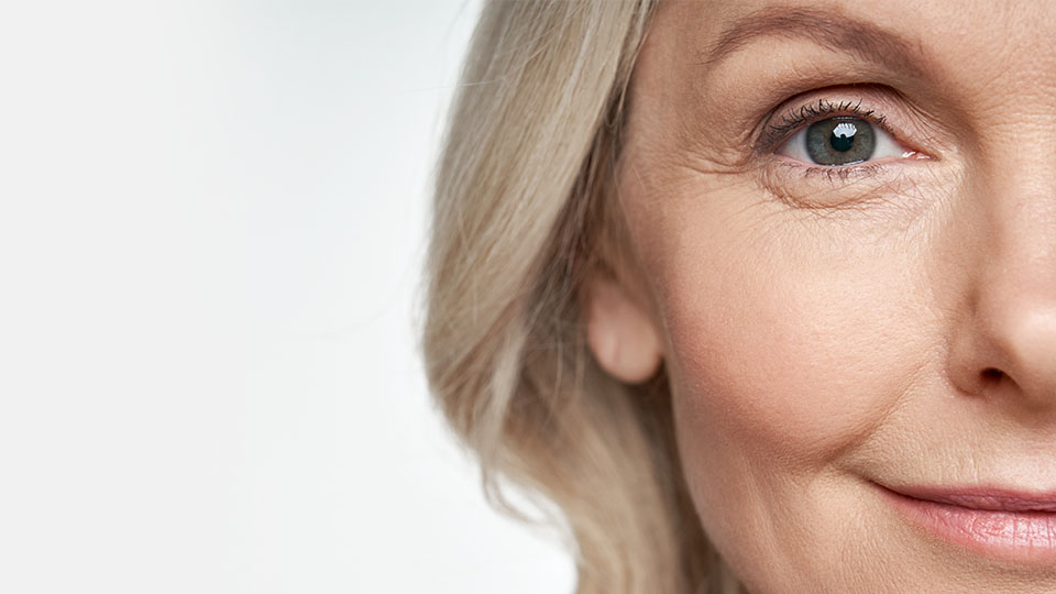 Image shows woman's face smiling